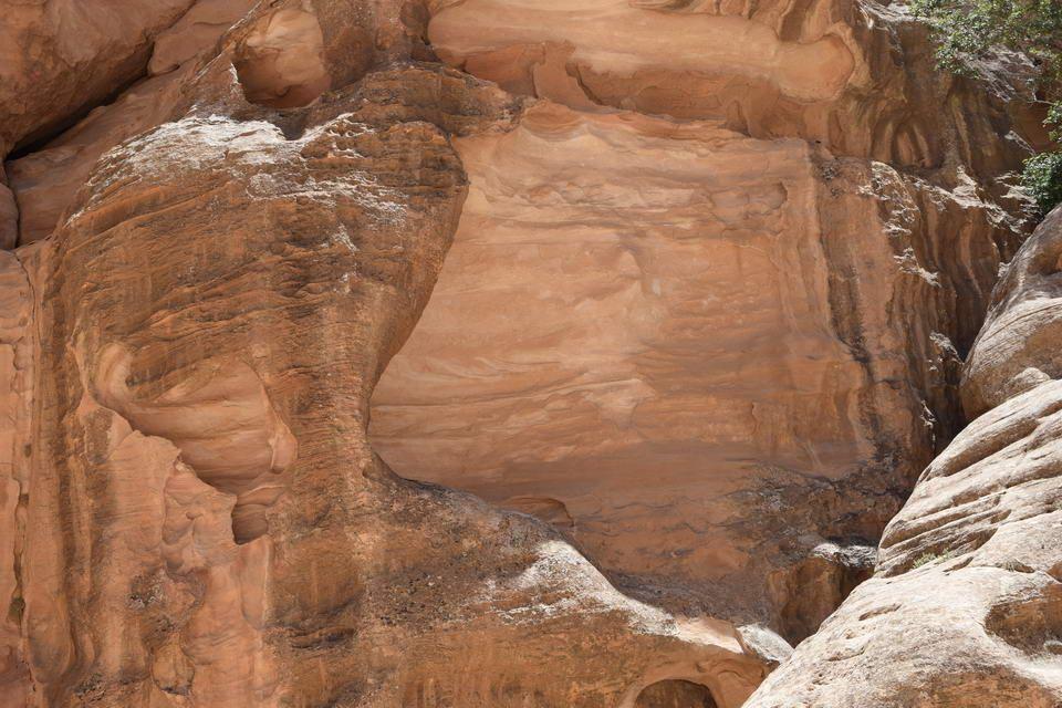 Carved Nabataean facade at the entrance of Little Petra, Siq al-Barid, Jordan